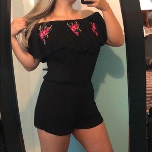 Off the shoulder black romper.
